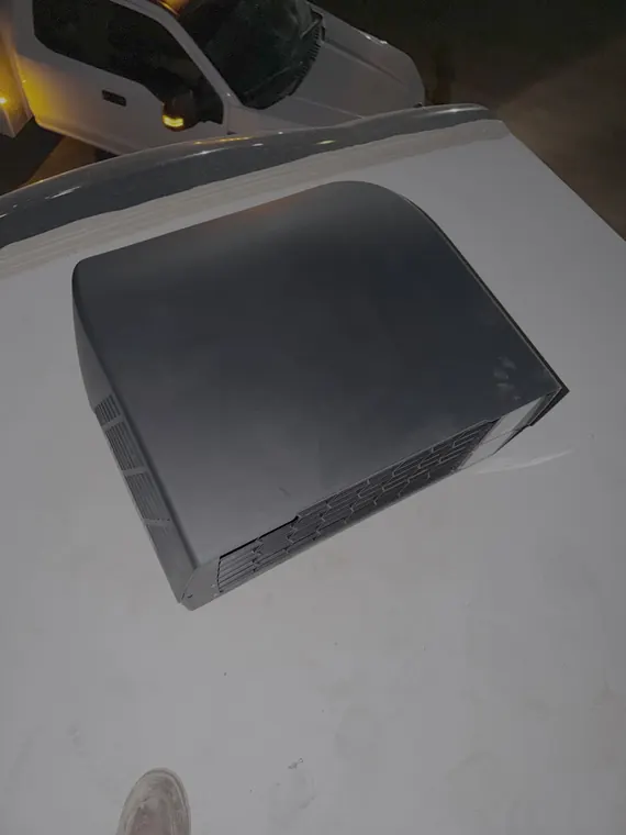 Rooftop air conditioner shroud removed on an RV roof during a service call