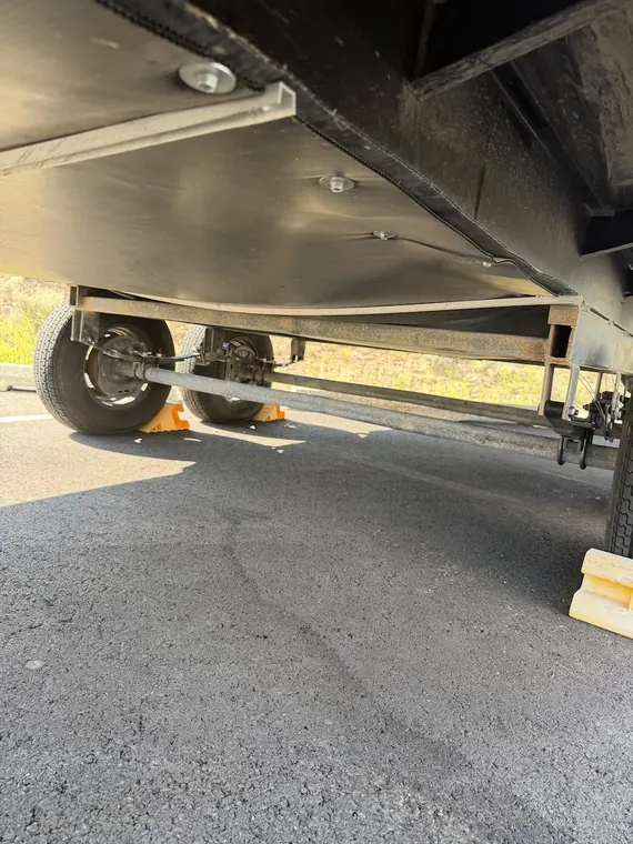 Underside of an extended slide-out room during service